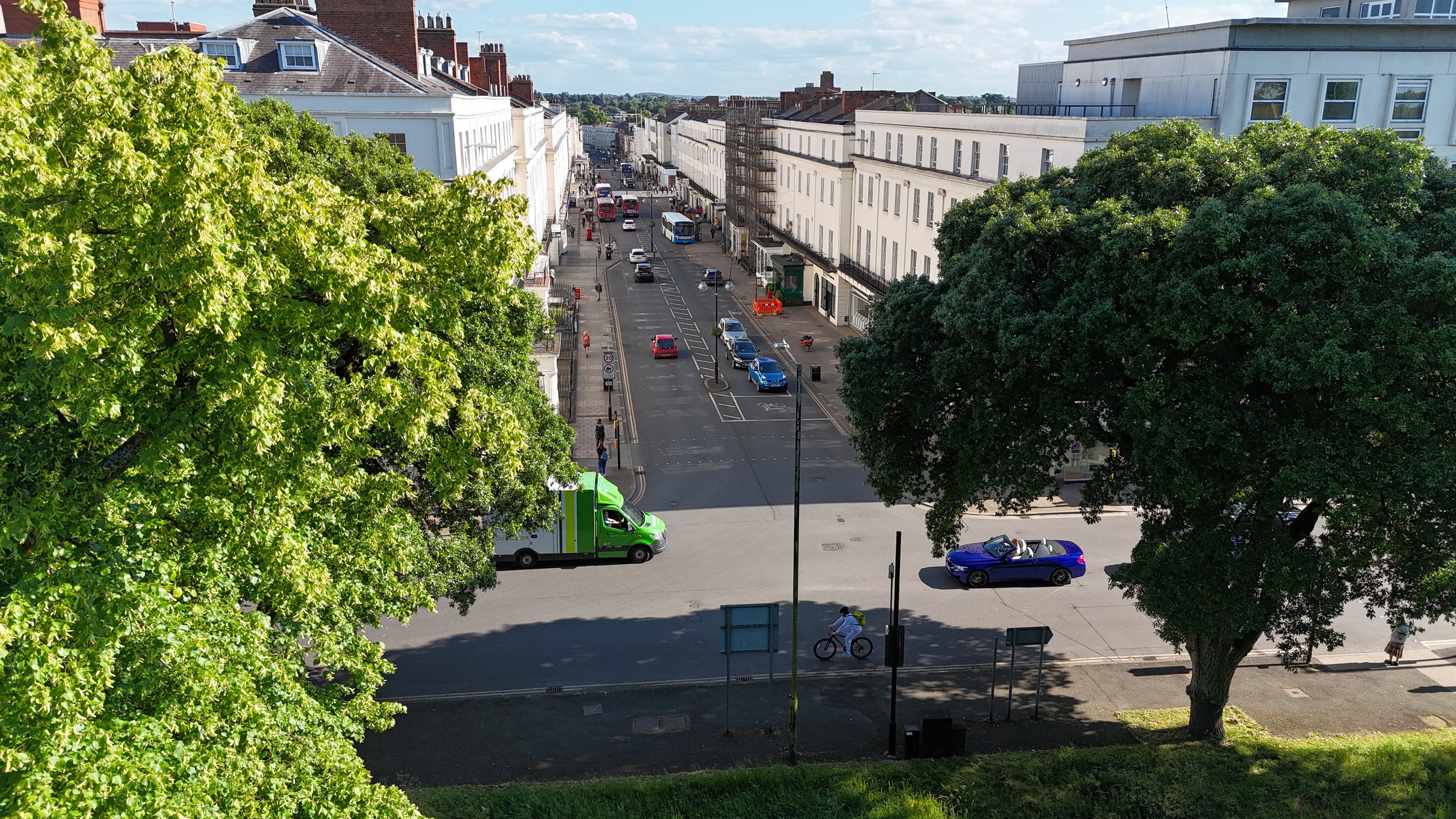 Street view of Leamington Spa with cars and buildings, viewed from an elevated position.